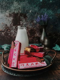 Close-up of red flower in container on table