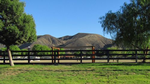 Scenic view of mountains against clear blue sky