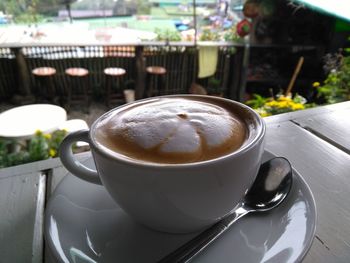 Close-up of coffee cup on table