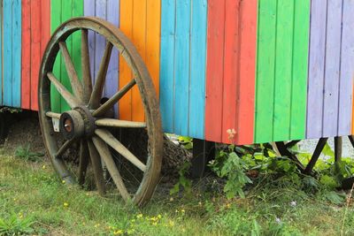 Bicycle on field against wall