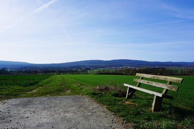 Scenic view of field against clear blue sky