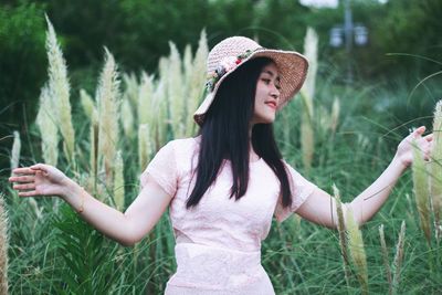 Woman wearing hat on field