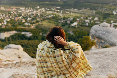 Rear view of woman standing outdoors