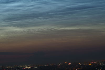 High angle view of illuminated buildings against sky at sunset