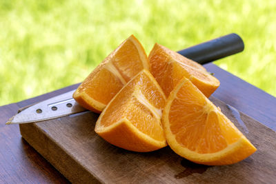 Close-up of orange slice on cutting board