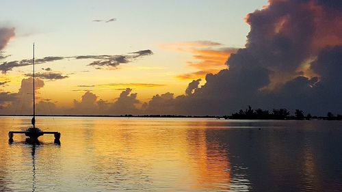 Scenic view of lake at sunset