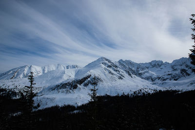 Scenic view of snowcapped mountains against sky