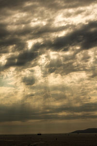Scenic view of sea against dramatic sky