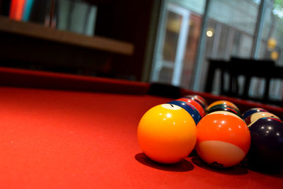 Close-up of balls arranged on pool table