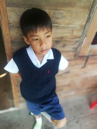 Portrait of cute boy standing outdoors