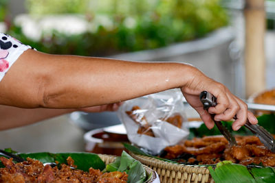 Midsection of person preparing food on table