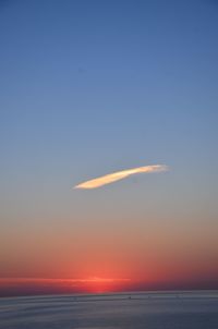 Scenic view of sea against romantic sky at sunset