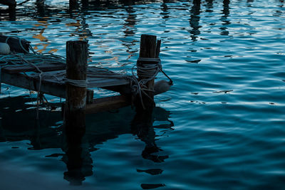 High angle view of wooden post in lake