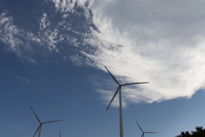 Low angle view of windmill against sky