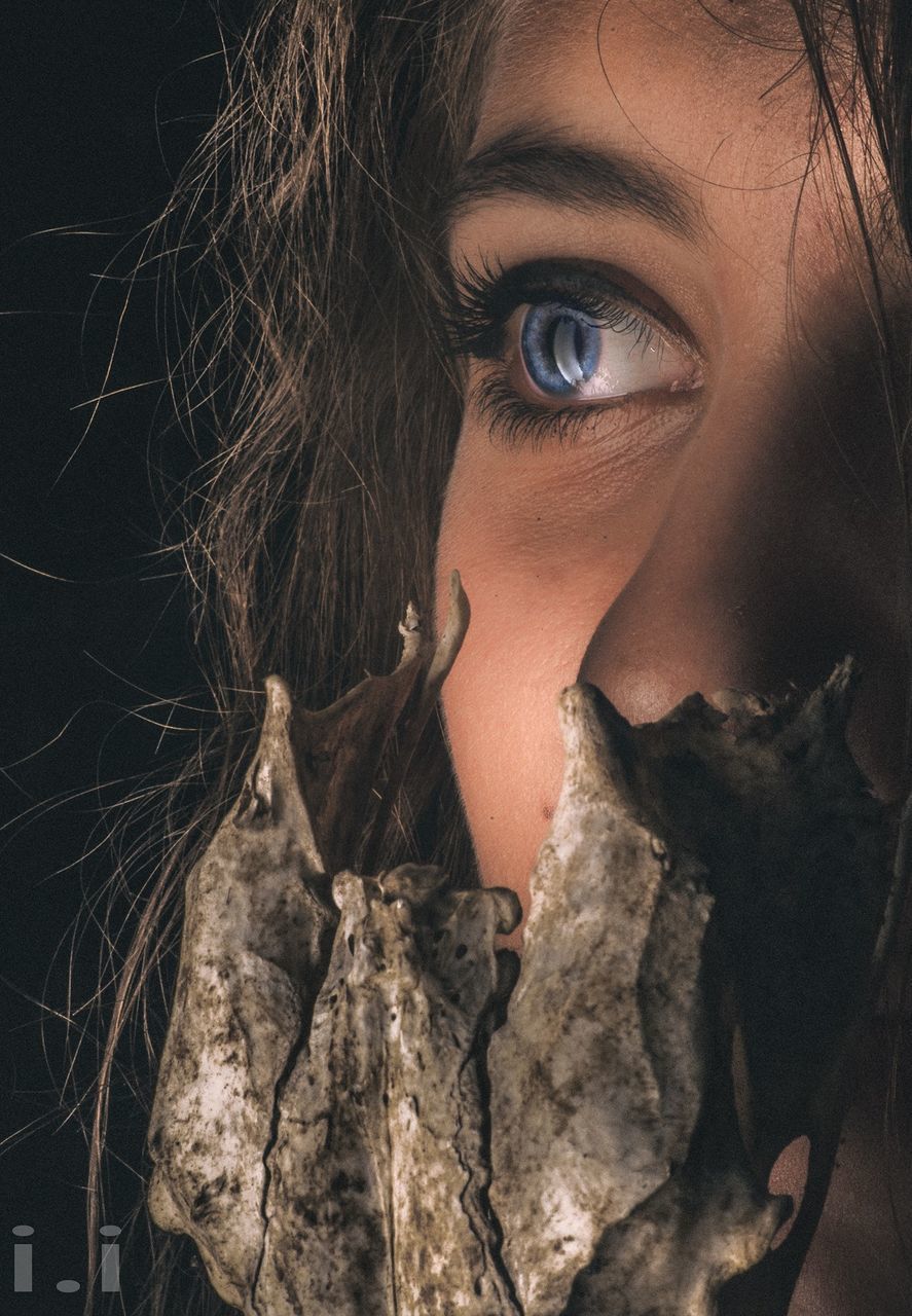 CLOSE-UP PORTRAIT OF A YOUNG WOMAN WITH HAIR