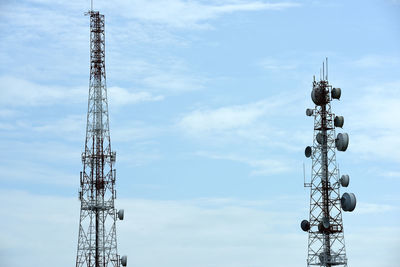 Low angle view of communications tower against sky