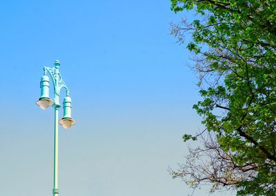 Low angle view of street light against sky