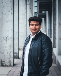 Portrait of smiling young man standing outdoors