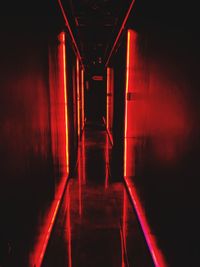 Empty corridor in illuminated building