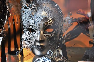 Close-up of masks for sale in store