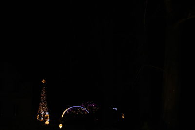 Low angle view of illuminated city at night