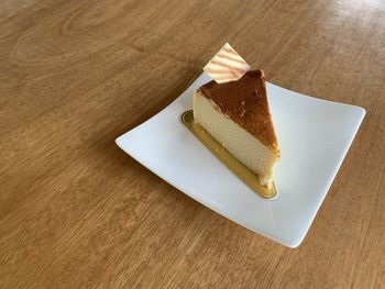 High angle view of cake slice in plate on table