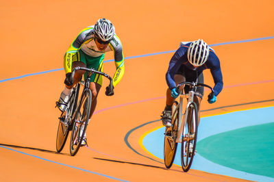 People riding bicycle on street