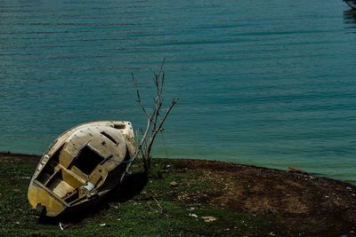 High angle view of abandoned boat moored at shore