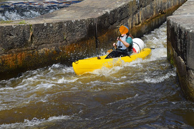 Woman kayak in canal