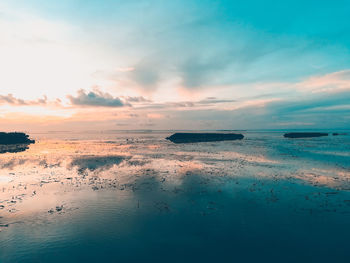 Scenic view of sea against sky at sunset