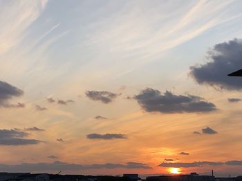 Low angle view of dramatic sky during sunset