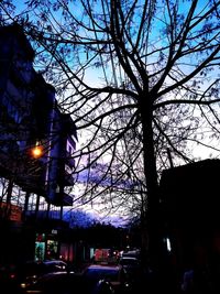 View of city street and buildings against sky