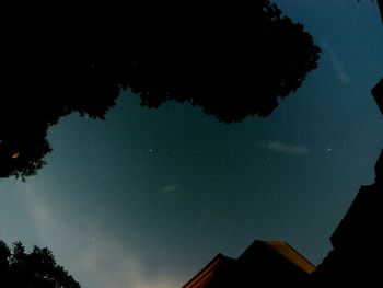 Low angle view of built structure against sky at night