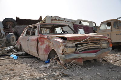 Abandoned car against clear sky