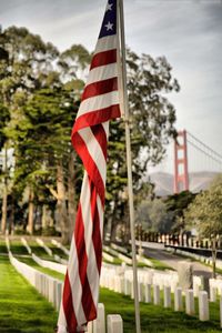 Low angle view of american flag against sky