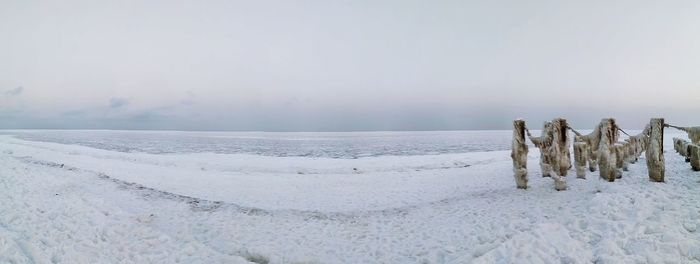 Scenic view of sea against sky during winter