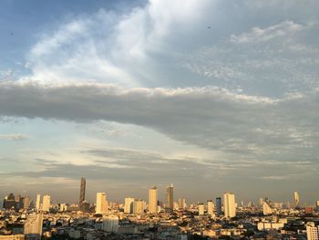 Modern buildings in city against sky