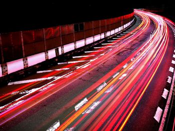 High angle view of light trails on road at night