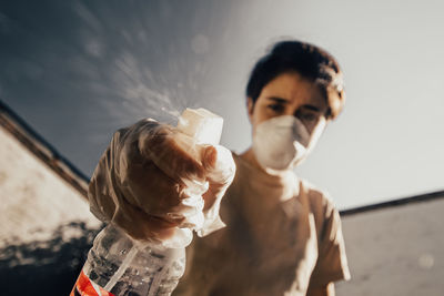 Portrait of man holding camera