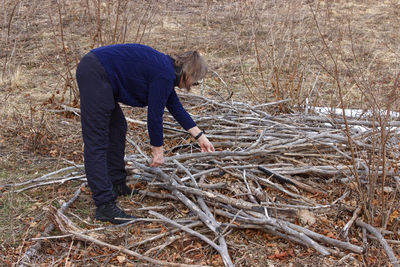 Side view of man working at farm