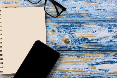 High angle view of smart phone on table