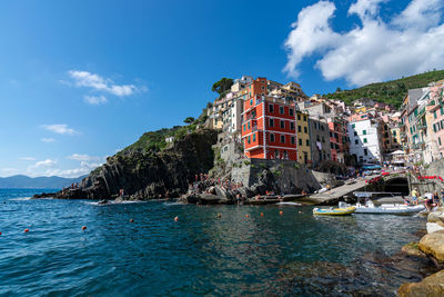 Panoramic view of sea and buildings against sky