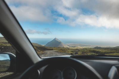 Low angle view of car against sky