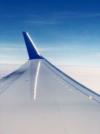 Low angle view of airplane flying in sky