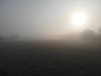 Scenic view of landscape against sky at morning