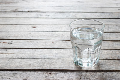 Close-up of glass of water on table