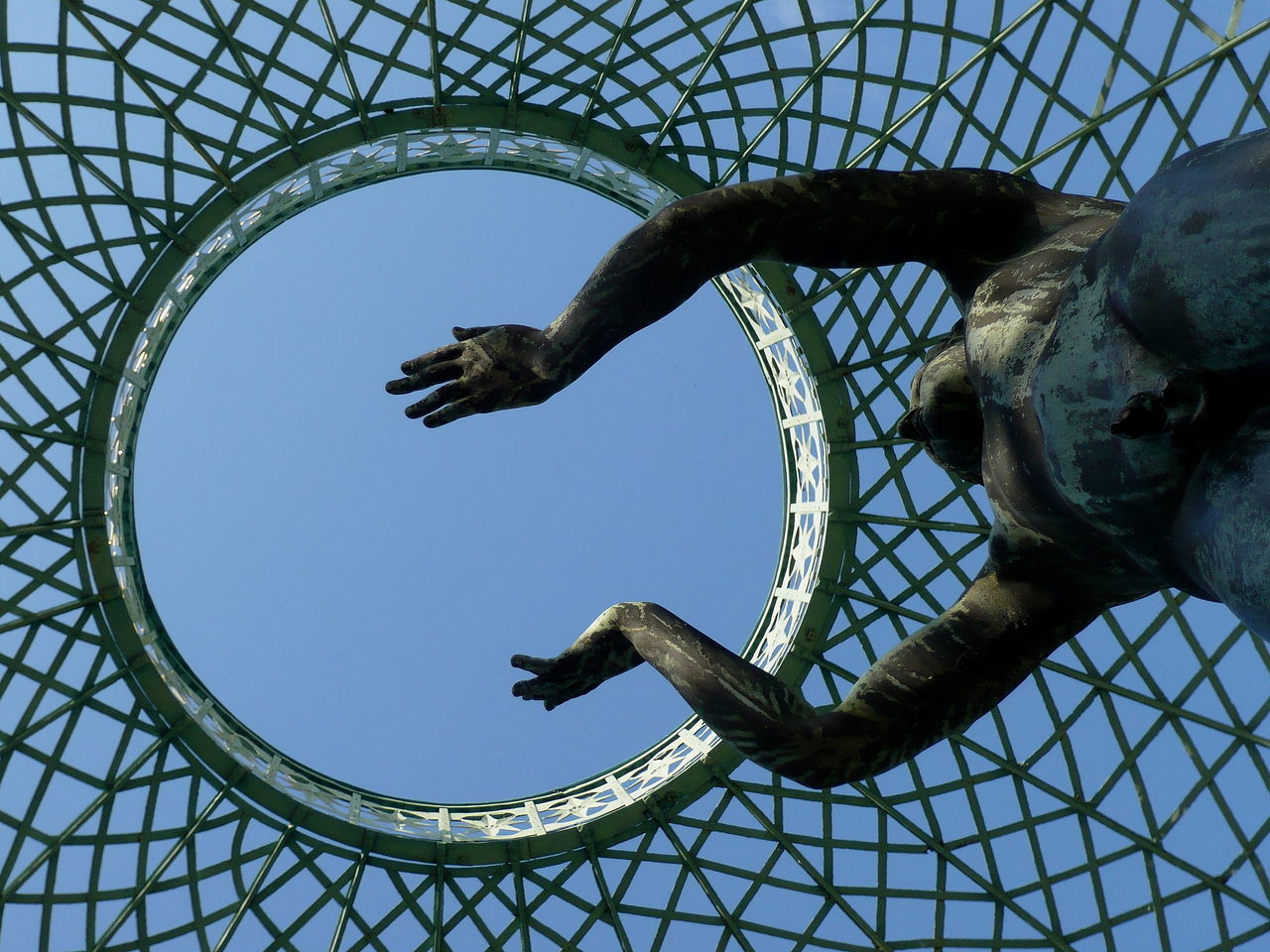 LOW ANGLE VIEW OF AN ANIMAL SCULPTURE