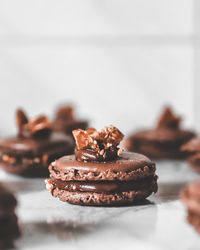 Close-up of chocolate caramel macarons on table