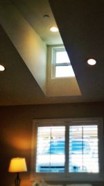 Low angle view of illuminated ceiling