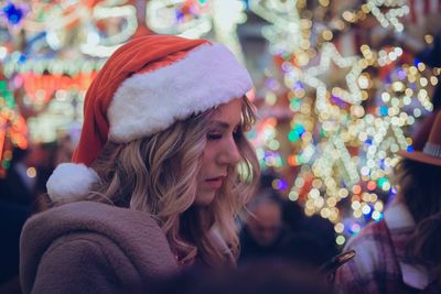 Portrait of young woman looking away at home